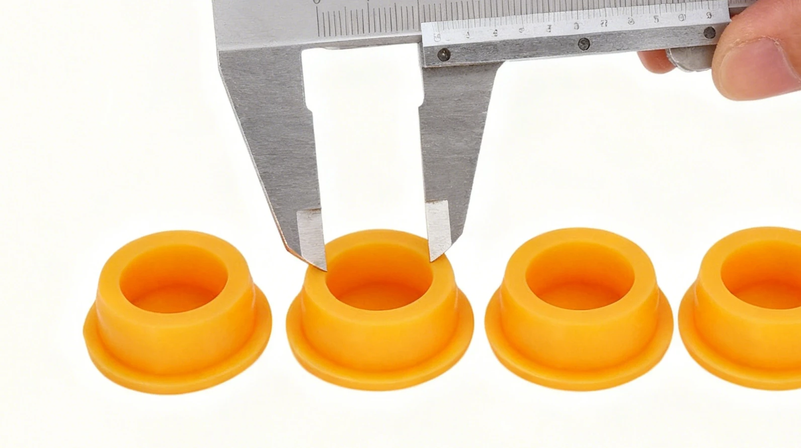 Digital caliper measuring the inner diameter of a port for silicone sealing plug design